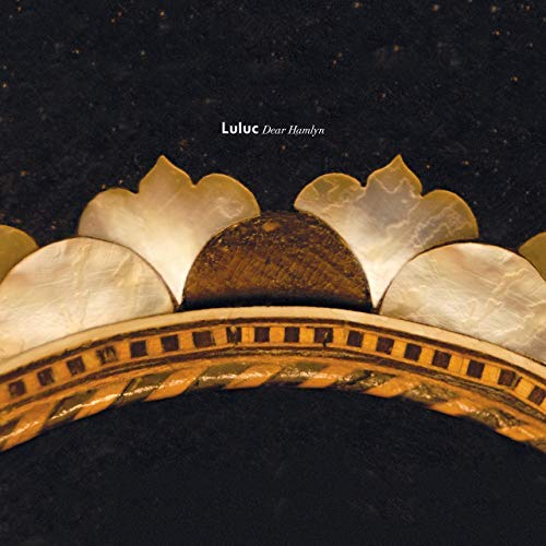 Vinyl record cover with gold and pearl-like decorative arch.