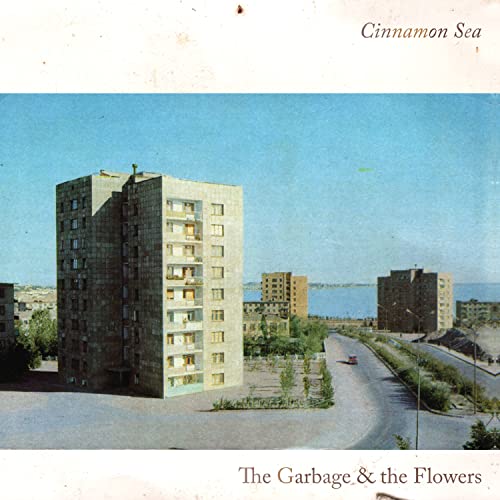 Album cover for "Cinnamon Sea" by Garbage & The Flowers, featuring Brutalist architecture.