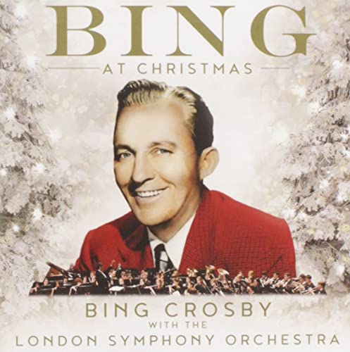 Bing Crosby portrait on CD cover with orchestra and snowy background.