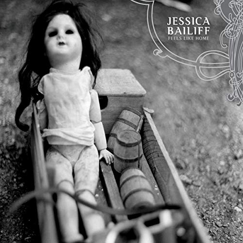 Vintage doll in a weathered wagon, album cover for Jessica Bailiff.