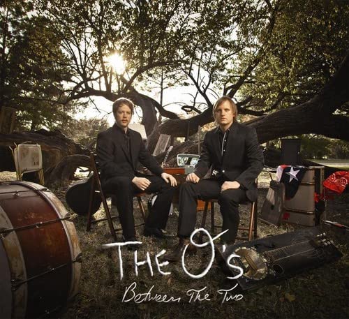 CD cover for "The O's - Between The Two" featuring two men outdoors.