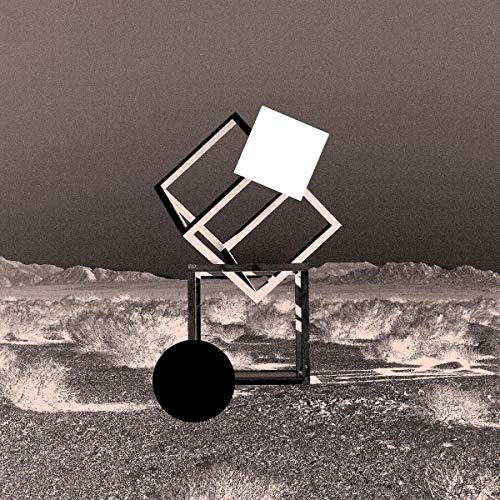 Abstract geometric shapes over a desert landscape, album cover art.