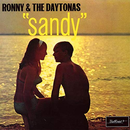 1960s record cover featuring a couple on a beach at sunset.