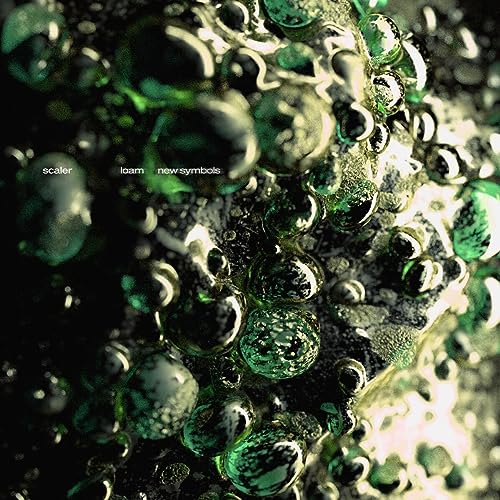 Vinyl record cover with abstract green and gold bubble-like textures.