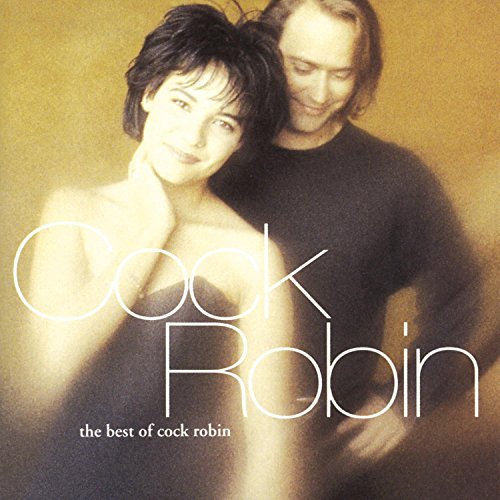 A man and woman pose together on the Cock Robin best of album cover.