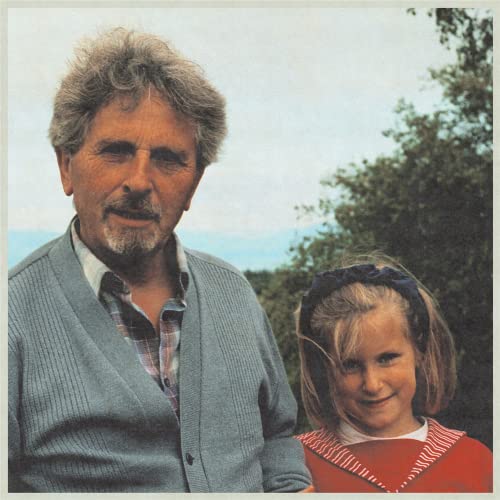Vintage photo of a man and a young girl outdoors.