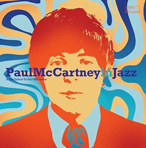 Vinyl album cover: Paul McCartney portrait with psychedelic swirl background.