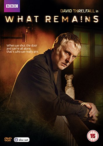 DVD cover for “What Remains” featuring David Threlfall in a dimly lit interior.