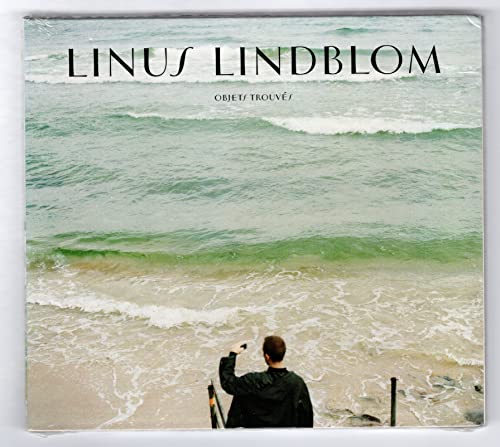 CD cover with a seascape and a person facing the ocean.