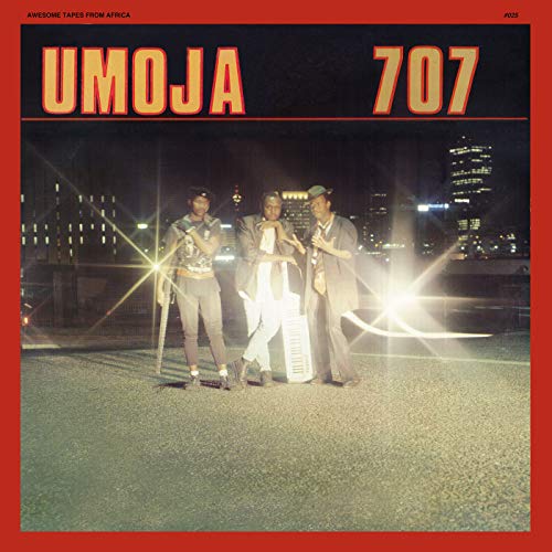Album cover for Umoja 707 featuring three men in suits at night.