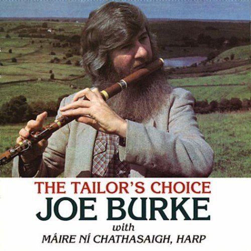 A bearded man playing a wooden flute in a rural landscape on a CD cover.