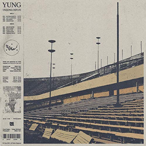 Vinyl cover showing empty stadium seating with tall light poles and tracklist text.