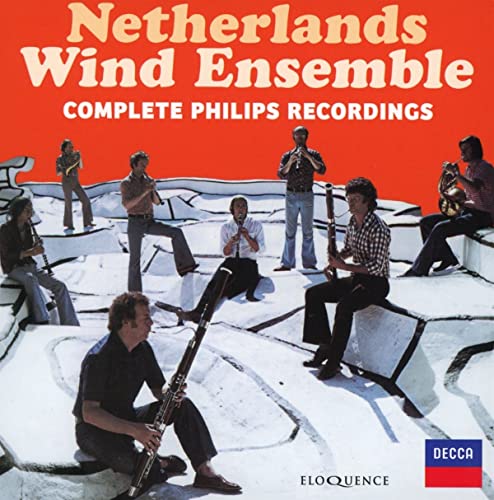 CD cover featuring seven musicians with wind instruments on a white landscape.