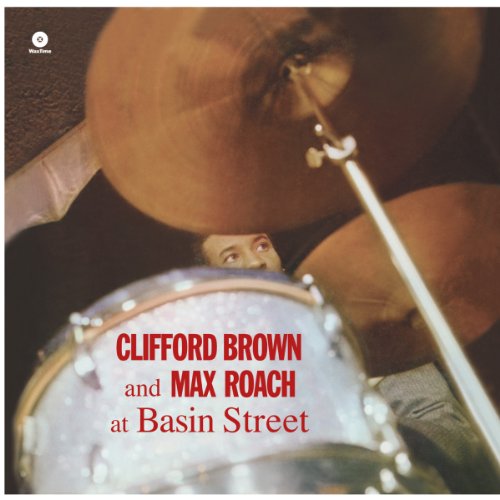 Vinyl album cover showing a drummer behind a drum kit with red text overlay.