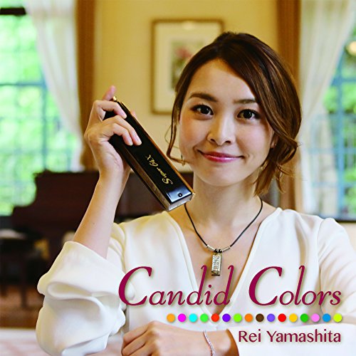 Woman holding a CD case, with album title "Candid Colors" below.
