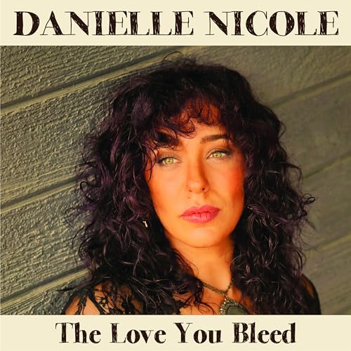 Vinyl album cover featuring a portrait of Danielle Nicole with curly hair.