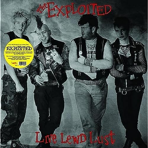 Black and white photo of four punk rockers with a yellow vinyl sticker.
