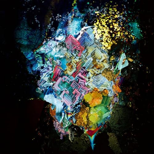Radwimps album cover: abstract, colorful cityscape against a dark background.