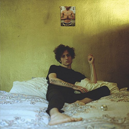 CD cover: person on bed with tattoos, small portrait above.