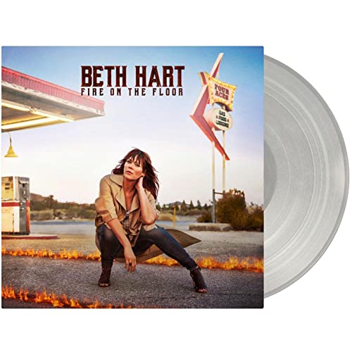 Beth Hart album cover with a woman and gas station, plus a vinyl record.