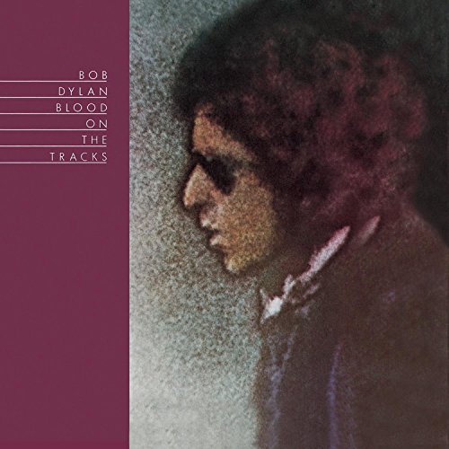 Album cover featuring a grainy profile portrait of Bob Dylan next to maroon text.