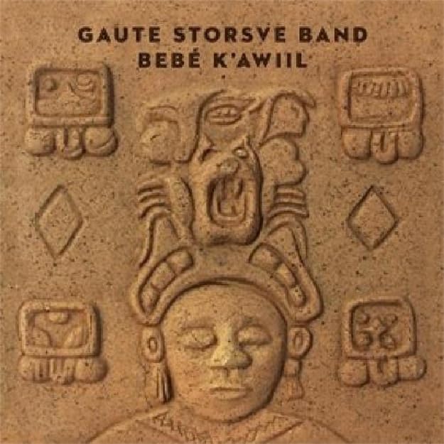 CD cover featuring a textured, beige carving of Mayan-style figures.