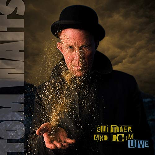 Tom Waits in a bowler hat, with glitter falling onto his hand.
