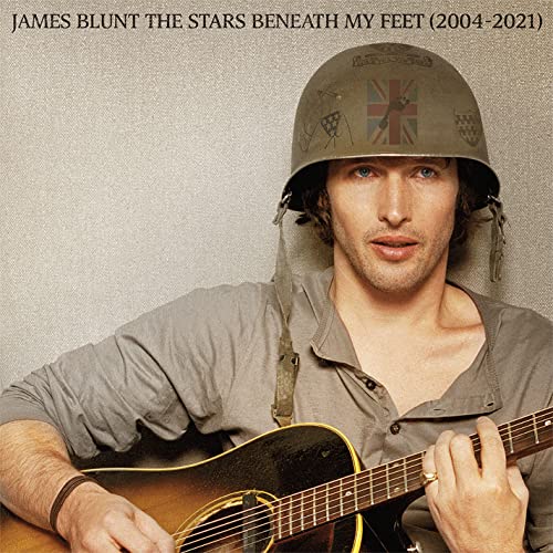 James Blunt album cover: man in helmet with guitar.