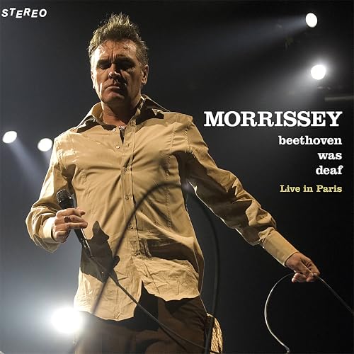 Morrissey performing live on stage, with album title text overlay.
