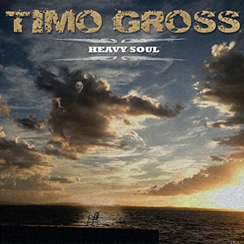 “Heavy Soul” CD cover with a face in stormy clouds over the sea.