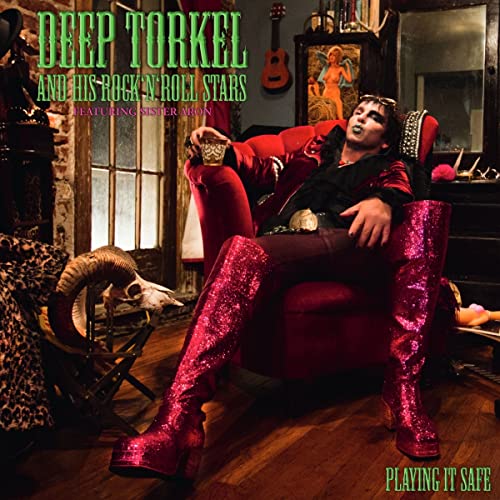 Album cover featuring a person in red boots seated in a red chair.