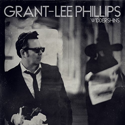 Black and white album cover featuring Grant-Lee Phillips and a costumed figure.