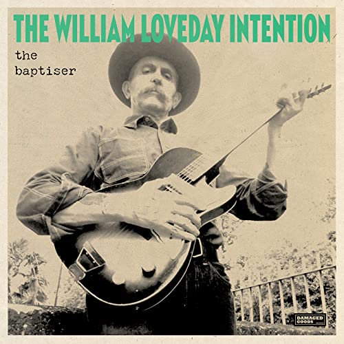 Vinyl record cover featuring a sepia-toned portrait of a man with a guitar.