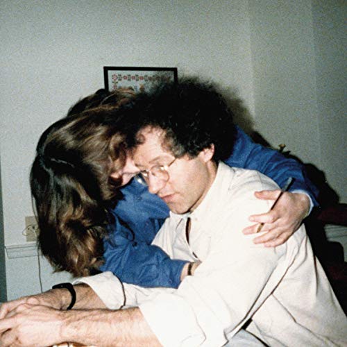 CD cover: a couple embracing, with a vintage, slightly grainy aesthetic.