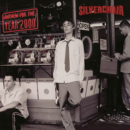 Silverchair album cover: band members in a laundromat, red neon sign.