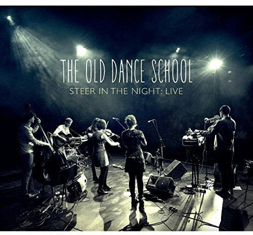 CD cover featuring a band performing on a dimly lit stage.