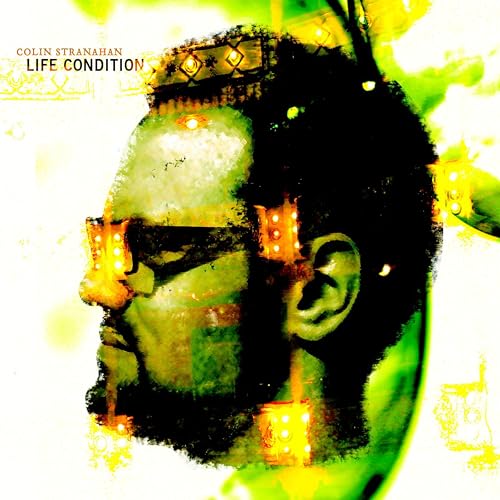 CD cover art: a man’s face with glowing orange and green accents.
