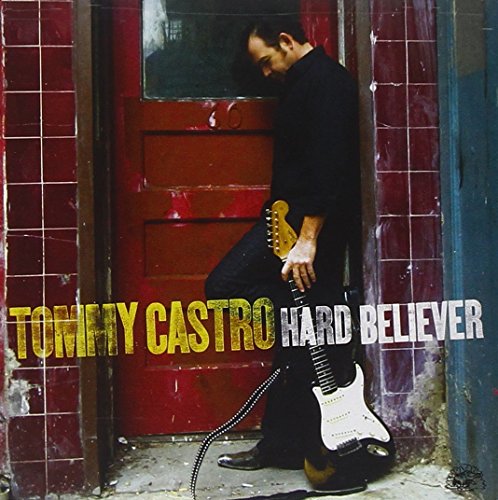 Tommy Castro album cover featuring a man with a guitar by a red door.