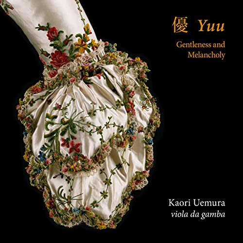 CD cover featuring a detailed, floral-decorated white garment fragment.