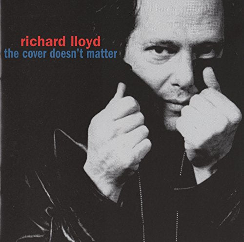Black and white portrait of Richard Lloyd with thumbs-up gestures.