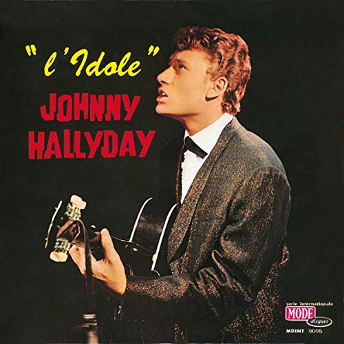 Johnny Hallyday album cover featuring a side profile of the singer with a guitar.