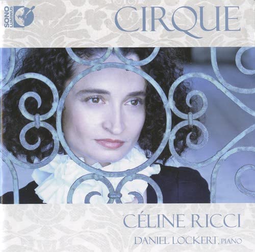 CD cover: woman’s face framed by ornate metalwork, text “CIRQUE” and “Céline Ricci”.