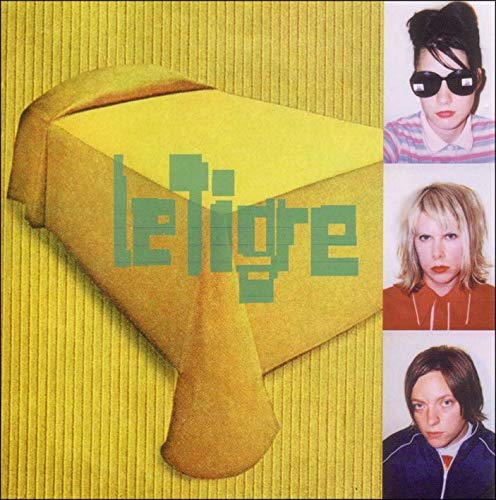 Vinyl cover with a yellow background, a table, and three portraits of band members.