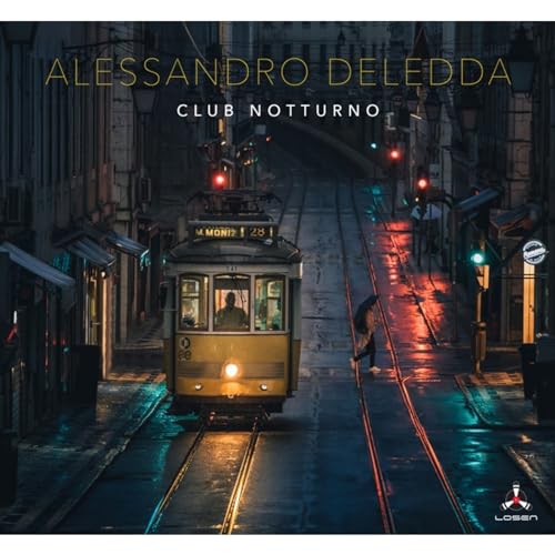 CD cover: nighttime street scene with a yellow tram and city lights.