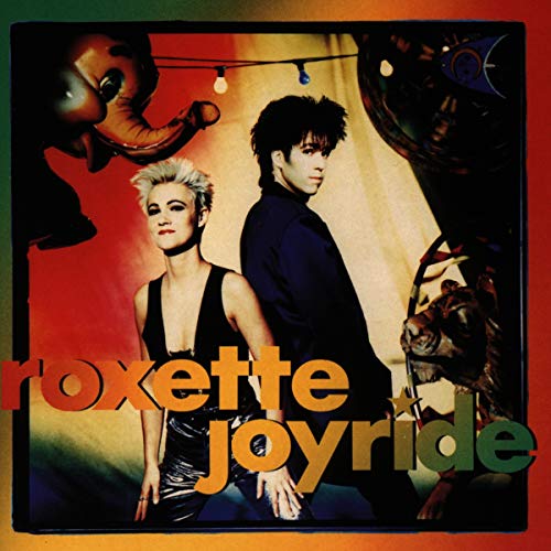 Roxette duo posing in front of carnival-themed props on the Joyride album cover.