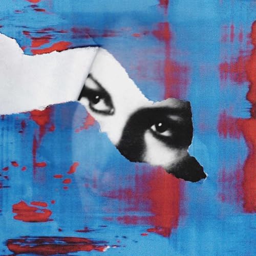 Close-up of an eye peering through a torn white paper on red and blue.