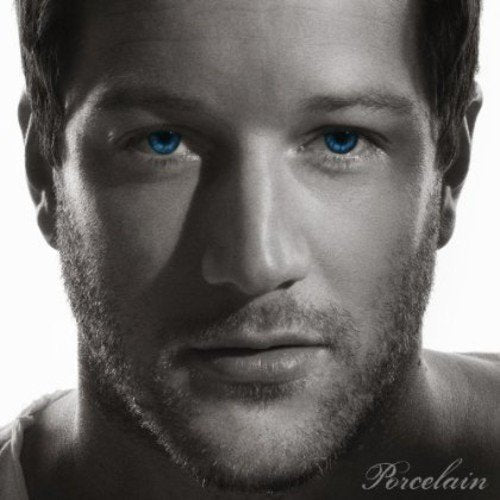 Black and white portrait of Matt Cardle with striking blue eyes.