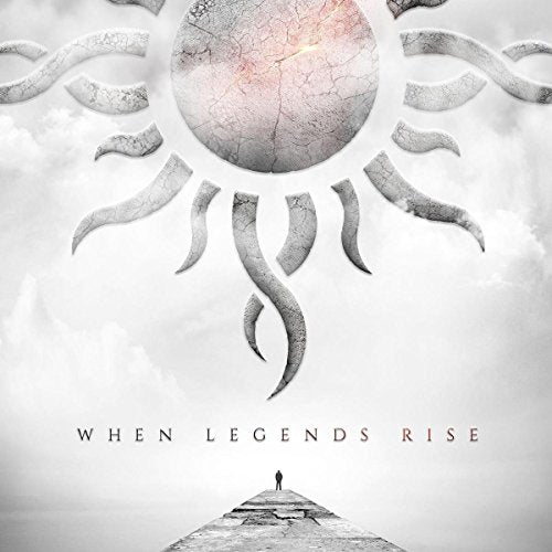 Godsmack album cover: cracked sphere with sun-like design and distant figure.