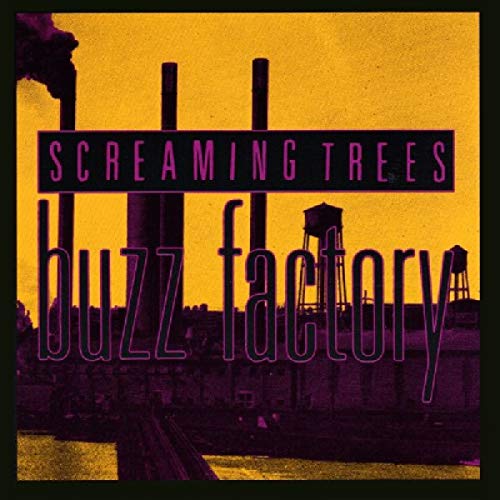 Album cover showing factory silhouettes against a yellow sky with purple text overlay.