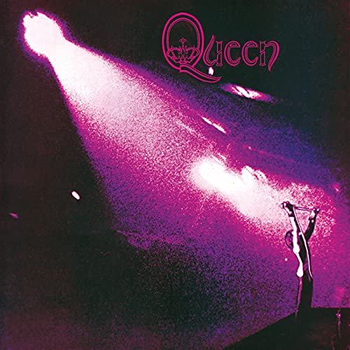 A silhouette of Freddie Mercury performing under a bright purple spotlight on stage.
